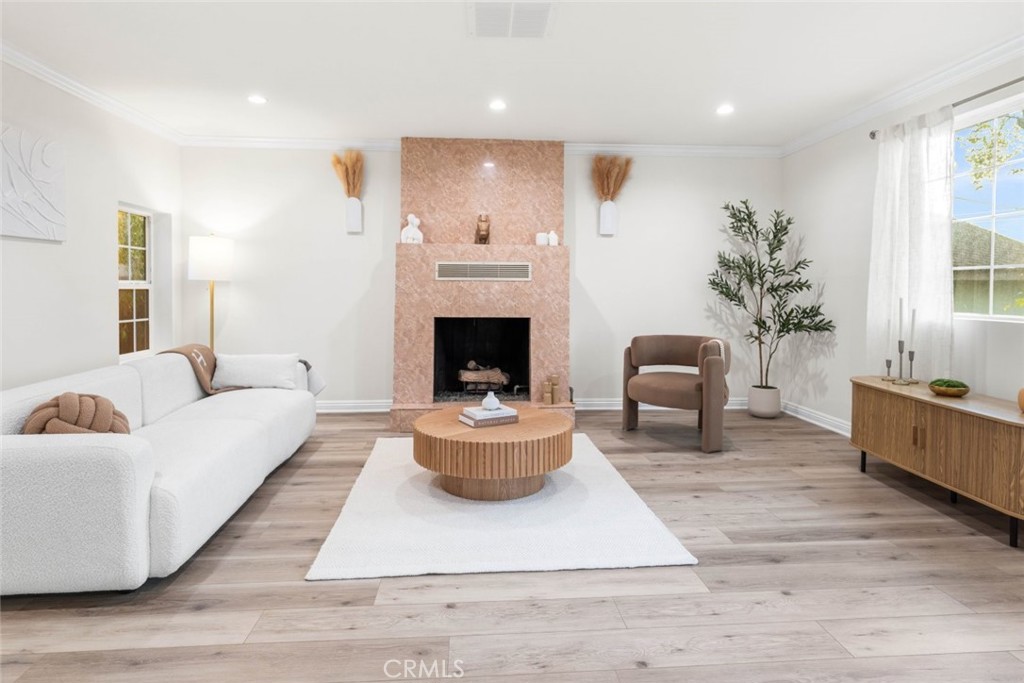 10554 Plainview Avenue Tujunga, CA 91042 - Photo 13 of 56 a living room with furniture fireplace and window