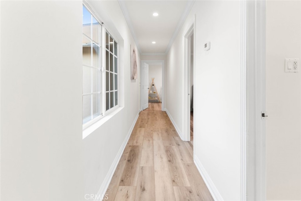 10554 Plainview Avenue Tujunga, CA 91042 - Photo 17 of 56 a view of a hallway with wooden floor