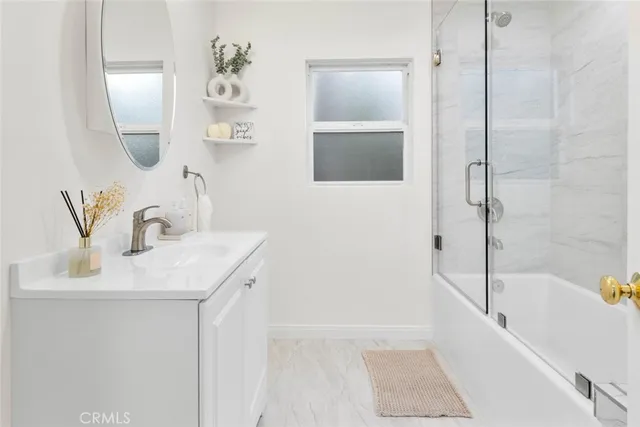 a bathroom with a bathtub and shower