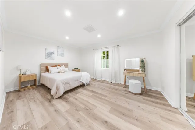 a bed room with a bed and a window