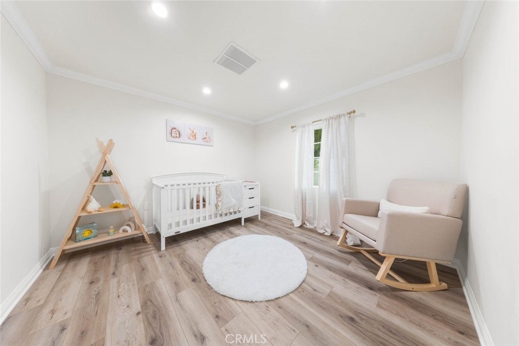 10554 Plainview Avenue Tujunga, CA 91042 - Photo 25 of 56 a view of a livingroom with furniture and hardwood floor