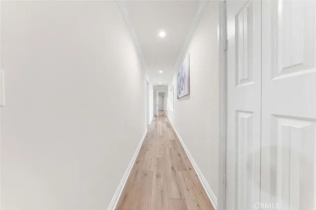 a large kitchen with stainless steel appliances kitchen island granite countertop a stove and a sink