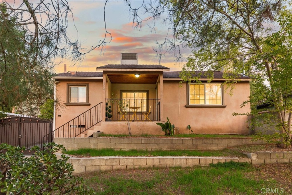 10554 Plainview Avenue Tujunga, CA 91042 - Photo 52 of 56 a front view of a house with garden