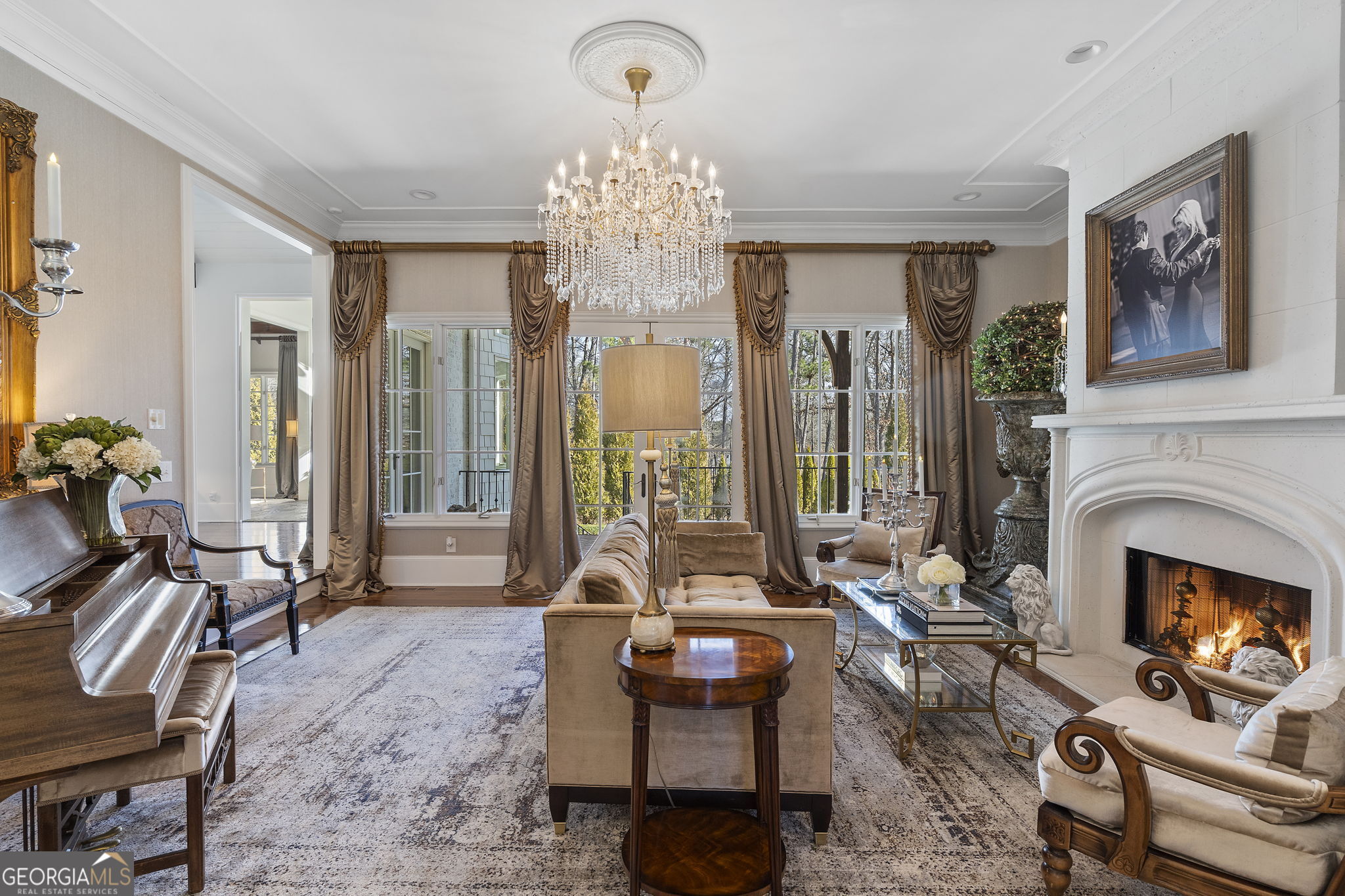 9 Belle Meade Drive Rome, GA 30165 - Photo 13 of 78 a living room with furniture a fireplace and a chandelier