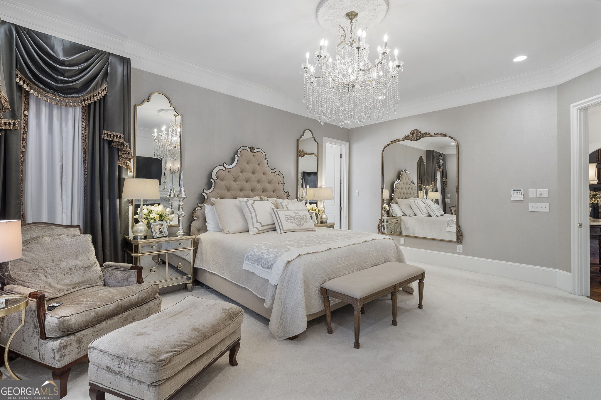 9 Belle Meade Drive Rome, GA 30165 - Photo 40 of 78 a spacious bedroom with a bed a chandelier and a mirror on the dresser