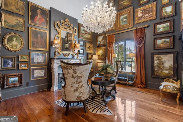 a view of a dining room with furniture and chandelier