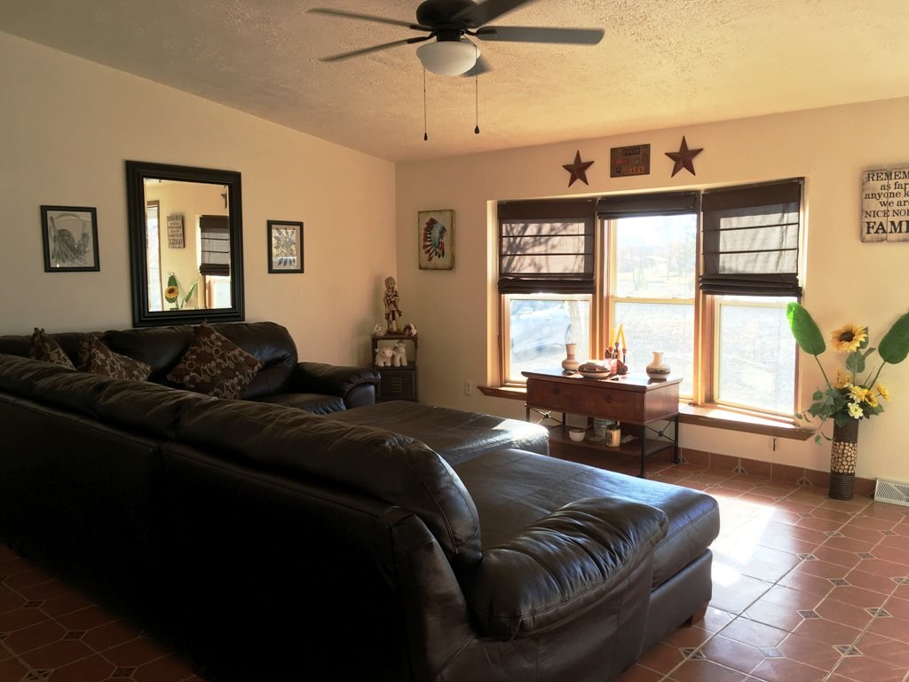 3708 2000 Road Delta, CO 81416 - Photo 14 of 42 a living room with a bed furniture and a window