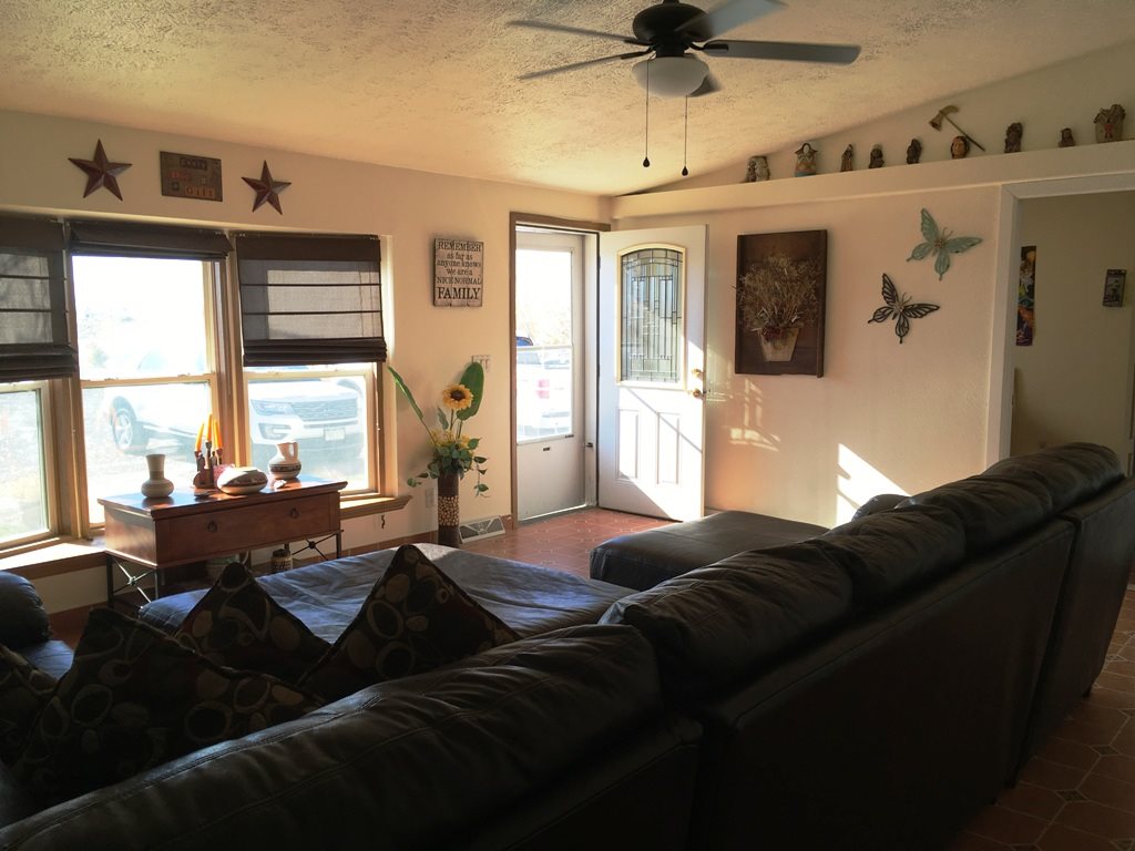 3708 2000 Road Delta, CO 81416 - Photo 17 of 42 a living room with furniture wooden floor and a window