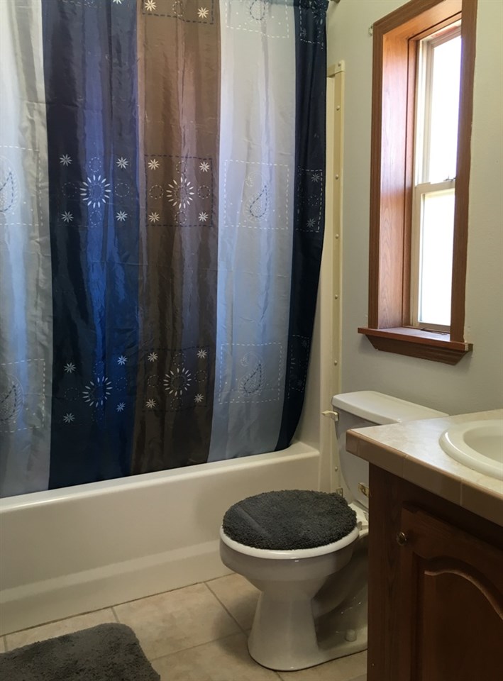 3708 2000 Road Delta, CO 81416 - Photo 23 of 42 a bathroom with a sink a toilet and shower