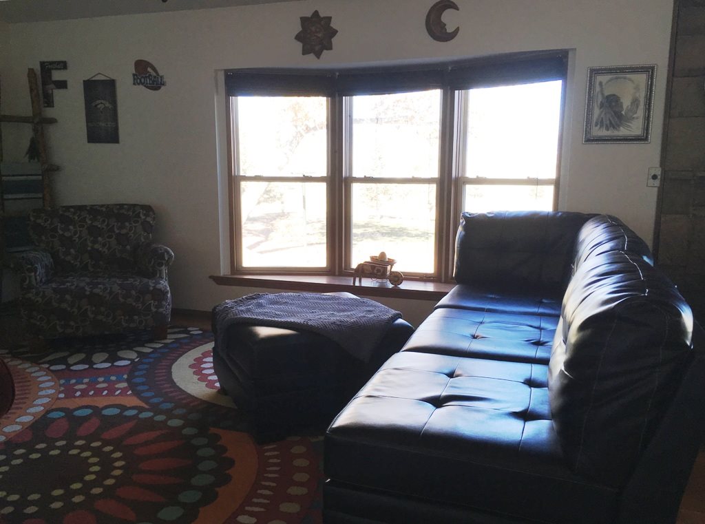 3708 2000 Road Delta, CO 81416 - Photo 3 of 42 a bed sitting in a bedroom next to a window