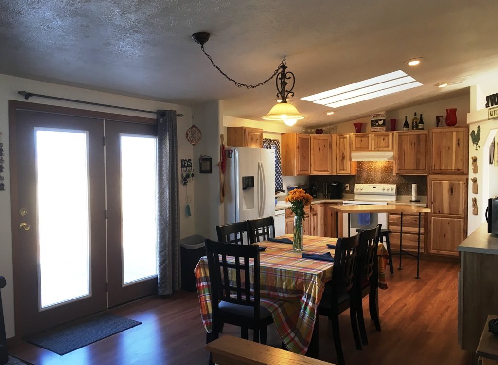 3708 2000 Road Delta, CO 81416 - Photo 4 of 42 a large kitchen with a table and chairs