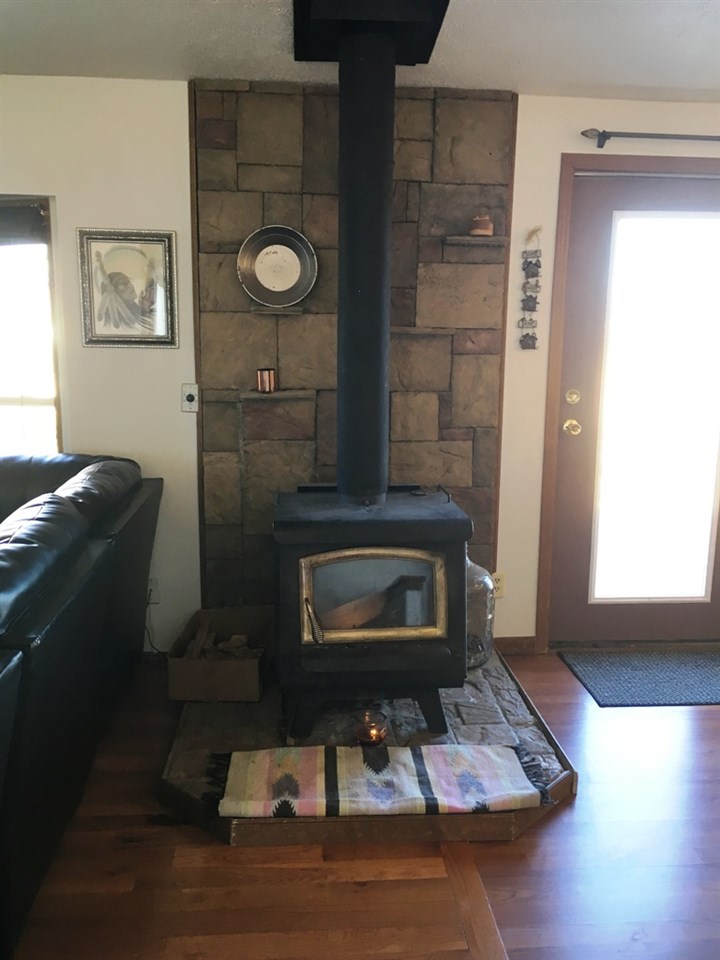 3708 2000 Road Delta, CO 81416 - Photo 5 of 42 a living room with furniture and a fireplace