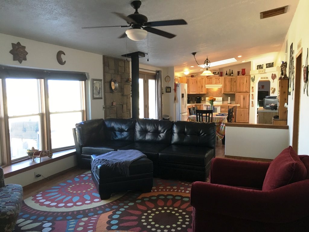 3708 2000 Road Delta, CO 81416 - Photo 7 of 42 a living room with furniture and a large window