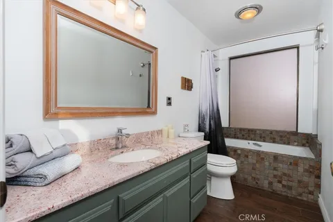 a room with pool table and windows