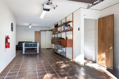 a view of roof deck with wooden floor and seating space