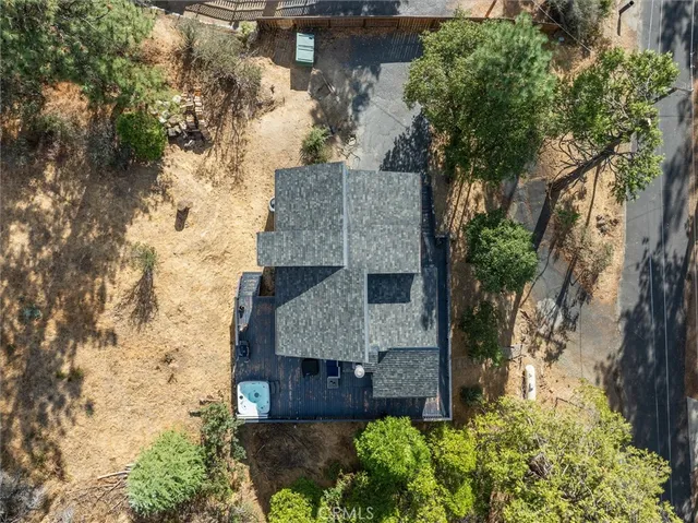 a view of hallway with a large window and wooden floor