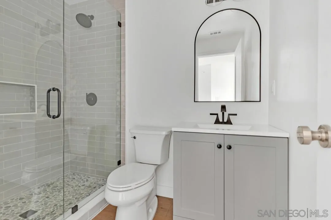 4922 Muir Avenue San Diego, CA 92107 - Photo 13 of 69 a bathroom with a sink toilet and shower