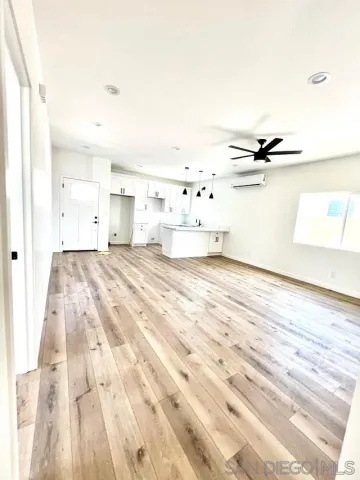 a bedroom with a bed and a night stand