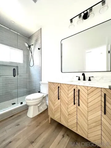 a bedroom with a bed and a potted plant