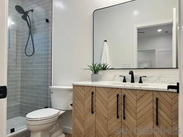 4922 Muir Avenue San Diego, CA 92107 - Photo 48 of 69 a bathroom with a sink a toilet and shower