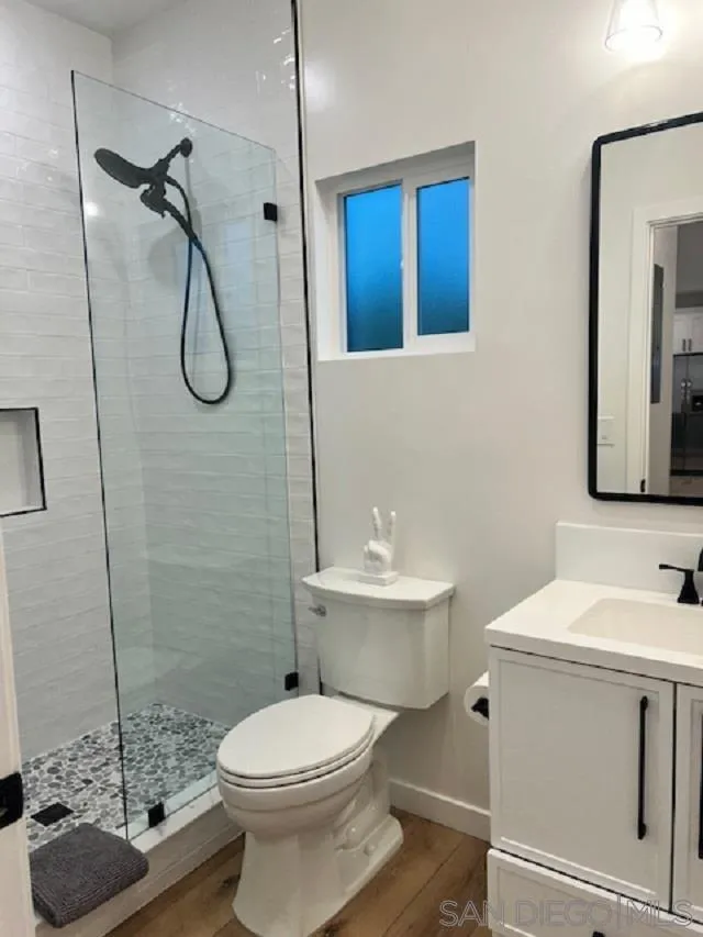 4922 Muir Avenue San Diego, CA 92107 - Photo 49 of 69 a bathroom with a sink a toilet and shower