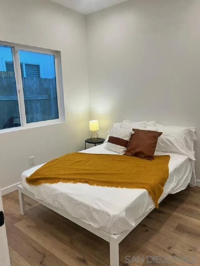 4922 Muir Avenue San Diego, CA 92107 - Photo 52 of 69 a bed sitting in a bedroom next to a window