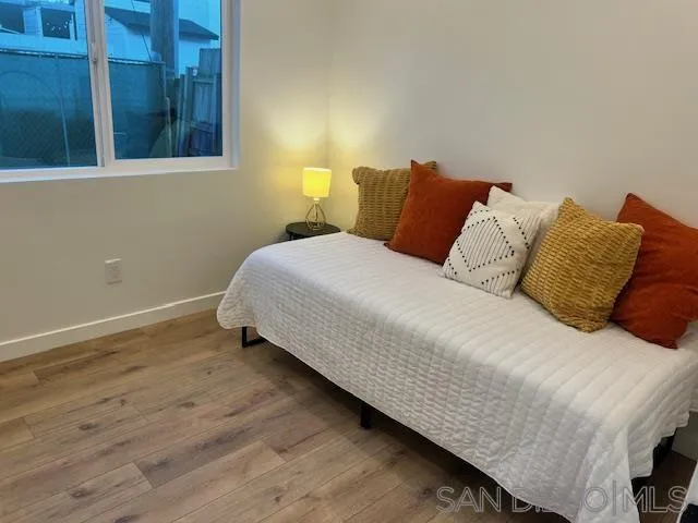 4922 Muir Avenue San Diego, CA 92107 - Photo 60 of 69 a large bed sitting in a bedroom next to a window