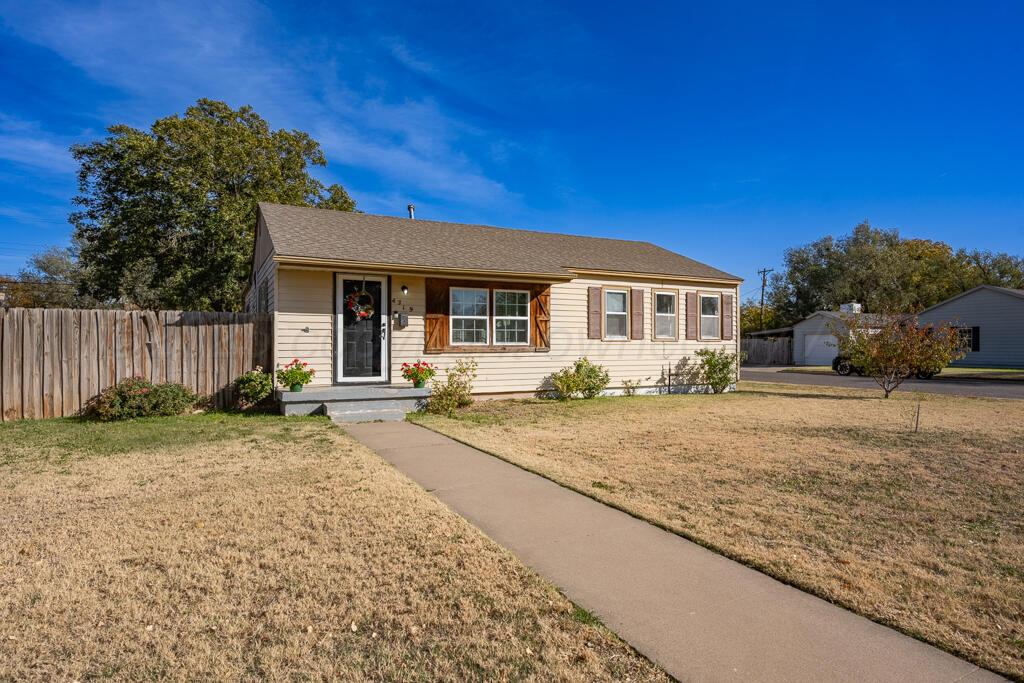 4319 South Lipscomb Street Amarillo, TX 79110 - Photo 14 of 28 a front view of a house with garden