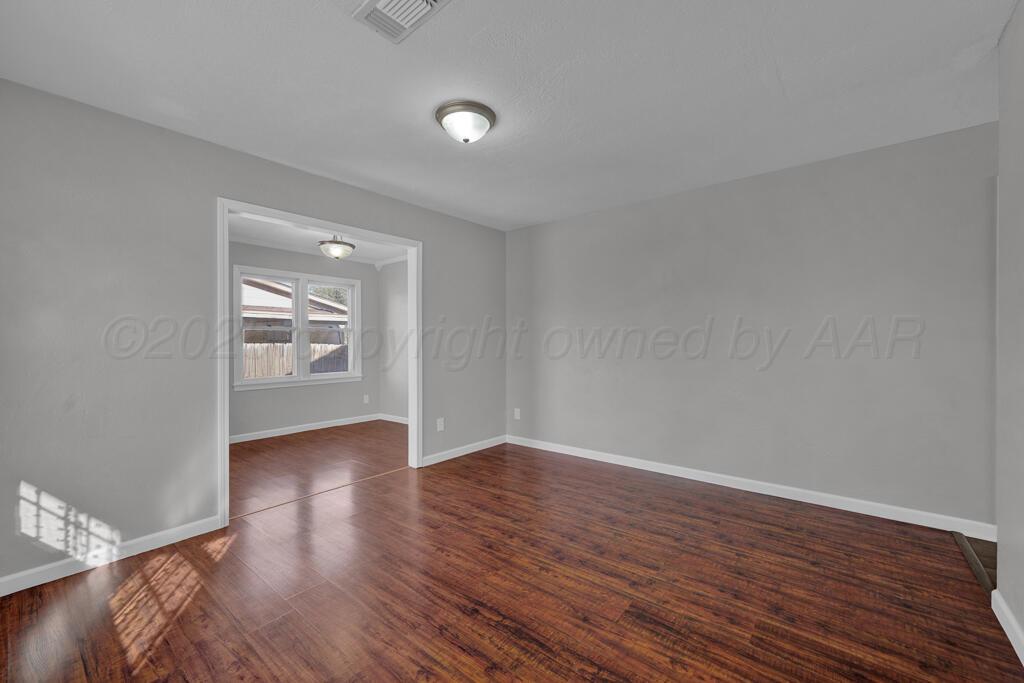 4319 South Lipscomb Street Amarillo, TX 79110 - Photo 16 of 28 a view of an empty room and wooden floor