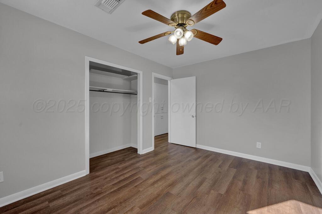 4319 South Lipscomb Street Amarillo, TX 79110 - Photo 23 of 28 an empty room with wooden floor and windows