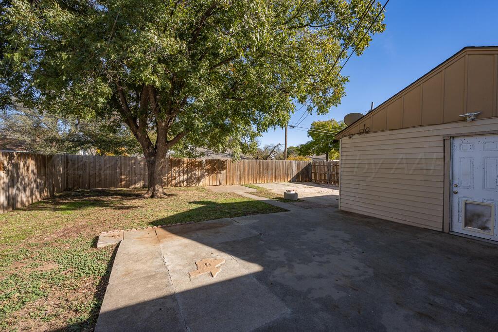 4319 South Lipscomb Street Amarillo, TX 79110 - Photo 26 of 28 a view of a yard with a tree
