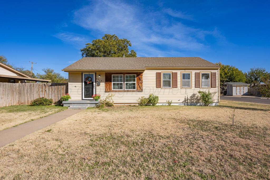 4319 South Lipscomb Street Amarillo, TX 79110 - Photo 28 of 28 a front view of a house with a yard and garage