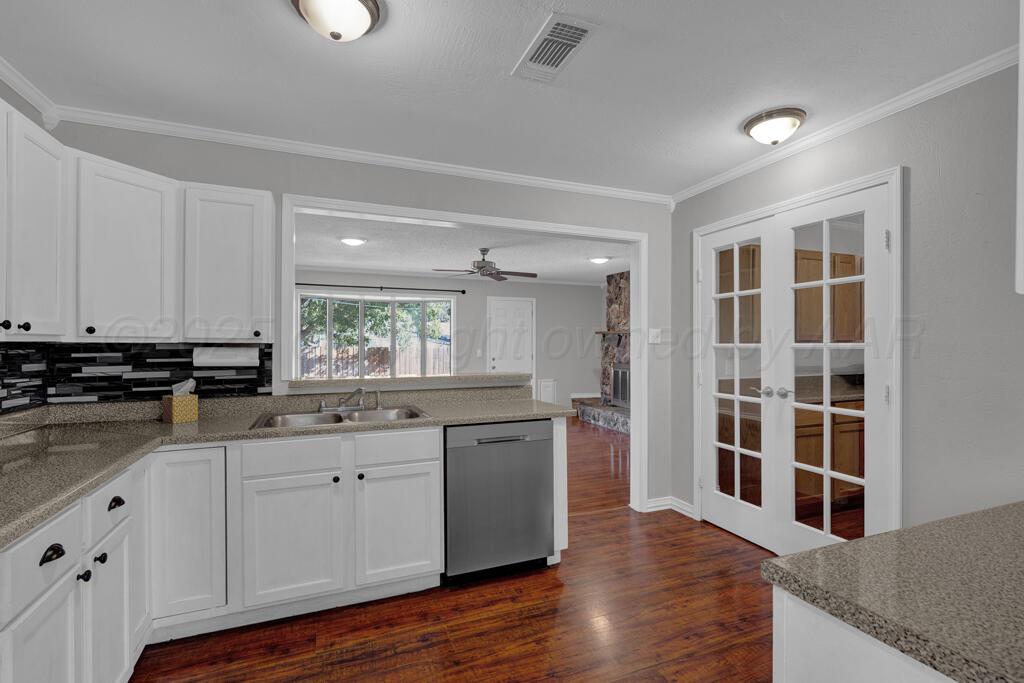 4319 South Lipscomb Street Amarillo, TX 79110 - Photo 5 of 28 a kitchen with a sink and cabinets