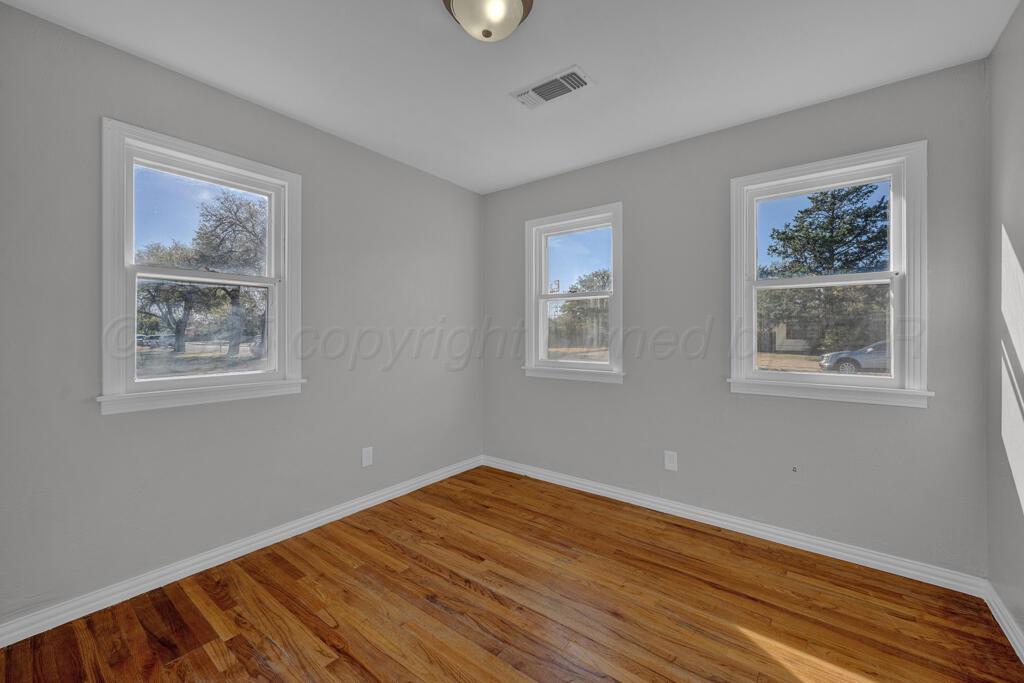 4319 South Lipscomb Street Amarillo, TX 79110 - Photo 7 of 28 a view of a room with wooden floor and window