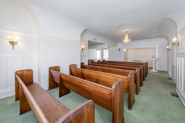 a room with lots of wooden furniture