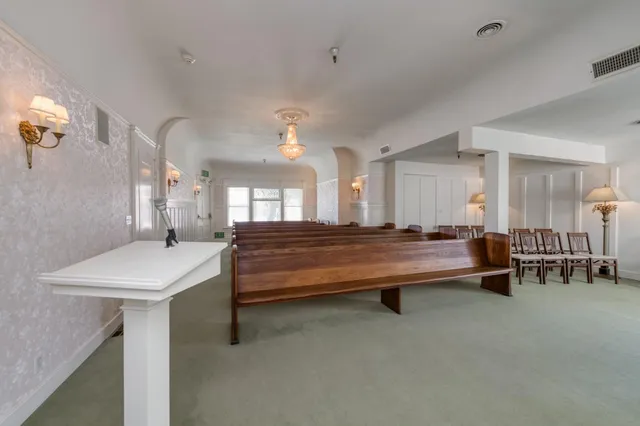 a room with furniture and a large window