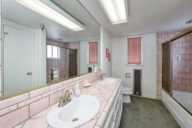 a view of a dining room with furniture and a window