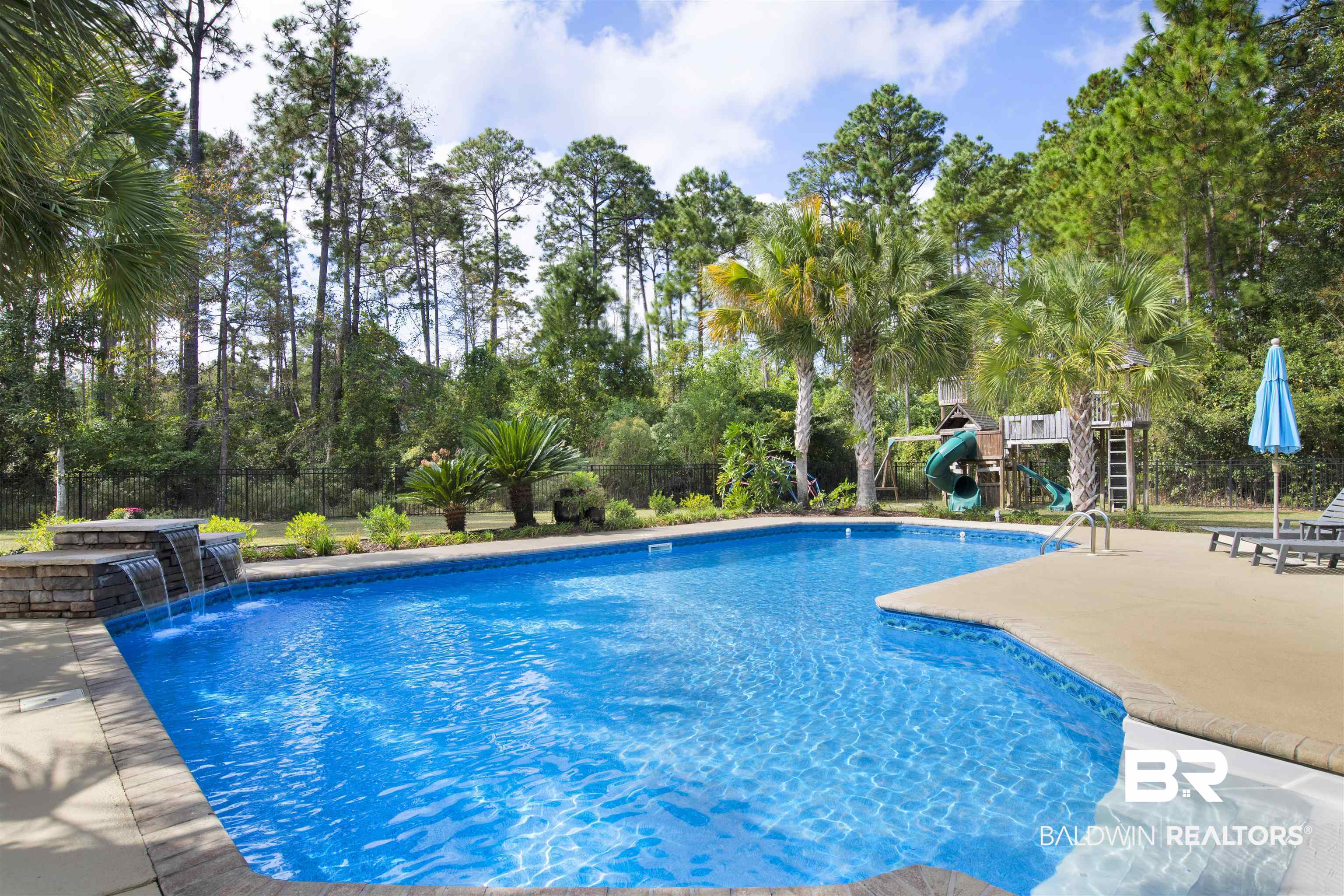 18360 Treasure Oaks Road Gulf Shores, AL 36542 - Photo 47 of 57 View of pool with pool water feature and a patio area