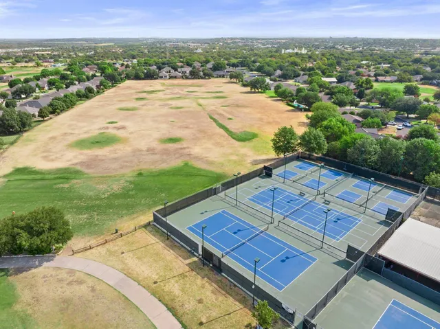 a view of a swimming pool with an outdoor space and seating area