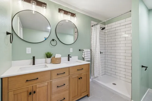 a bathroom with a sink and a shower