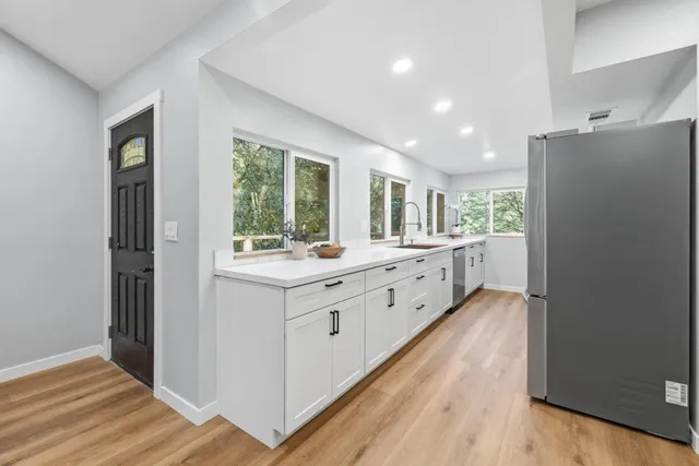 a bedroom with a large bed and a couch