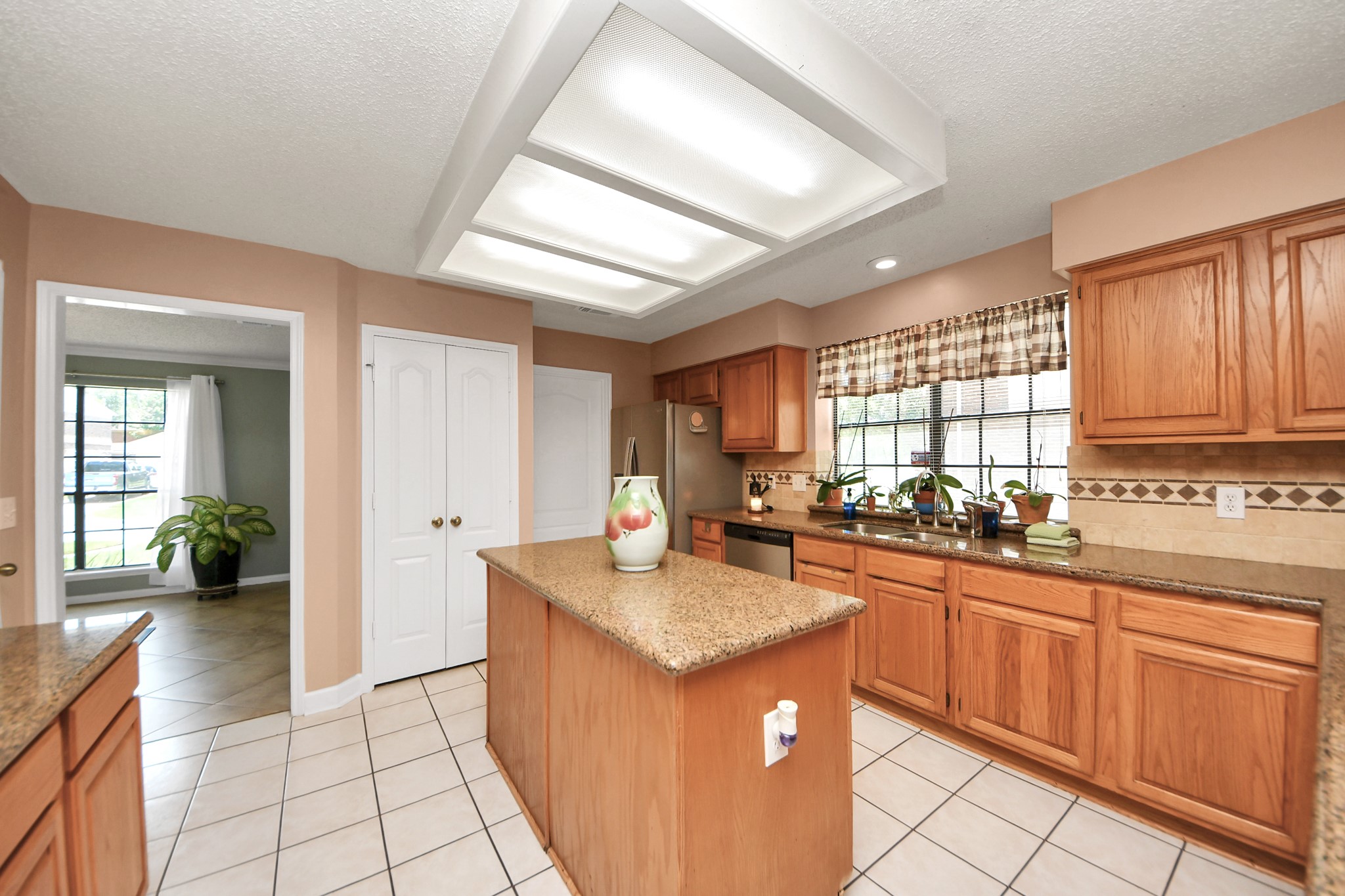 3107 Dulaney Road Houston, TX 77084 - Photo 12 of 50 a kitchen with granite countertop a sink stove and cabinets