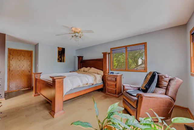 a bedroom with a bed and window