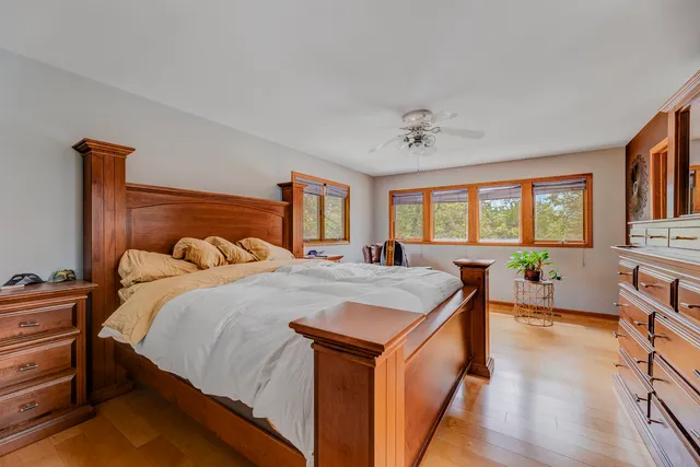a bed room with a bed and a chandelier
