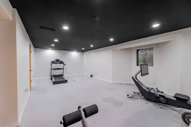 a room with furniture and gym equipment