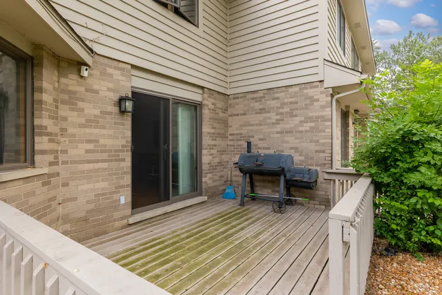 a backyard of a house with outdoor seating