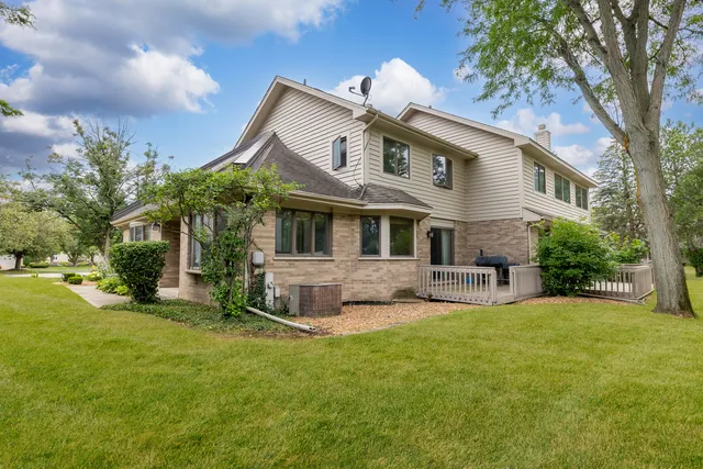 a view of a house with a yard porch and sitting area