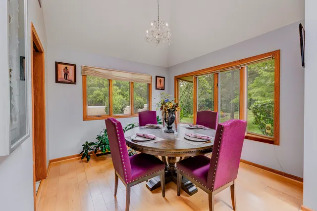 a view of a dining room with furniture window and wooden floor