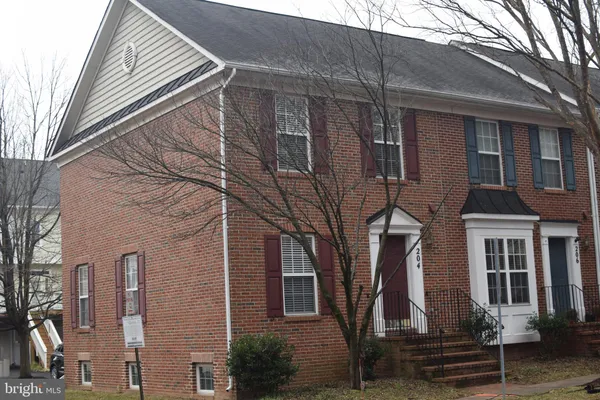 a front view of a house with stairs