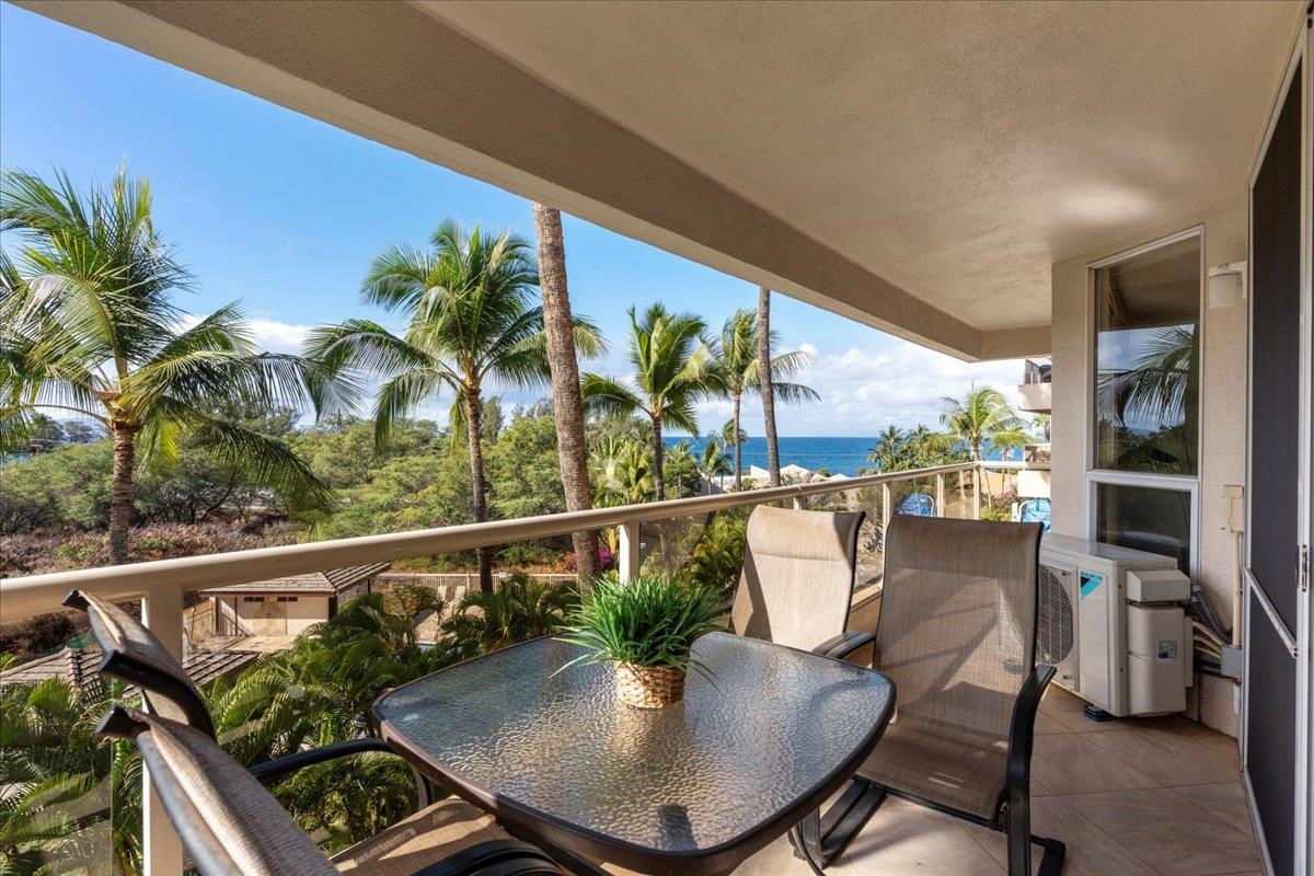2575 South Kihei Road, Unit G409 Kihei, HI 96753 - Photo 21 of 32 a view of a balcony with chairs and potted plants